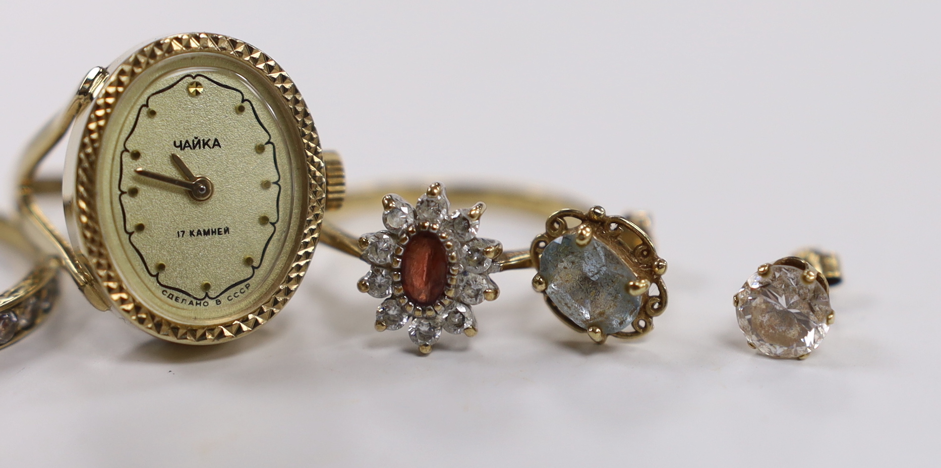 A modern 9ct and CZ set cluster ring, two other rings including watch ring and two pairs of 9ct ear studs.